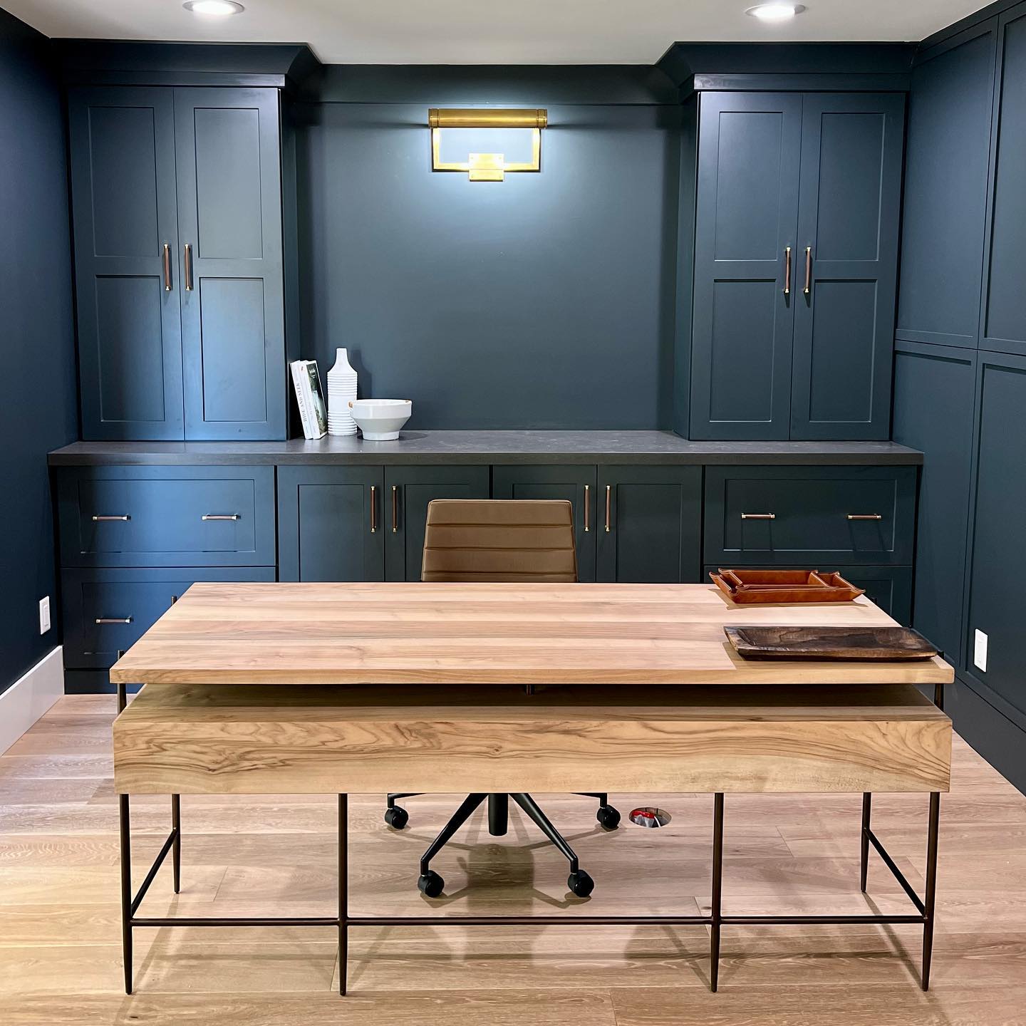 Storage is key in any office and with these closed doors you can hide everything and keep your work space spotless! #dreamoffice #workspace #designeroffice #blueoffice #builtinofficespace #modernoffice #farmhouseoffice #interiordesigner #customcabinetry #customoffice #homeoffice