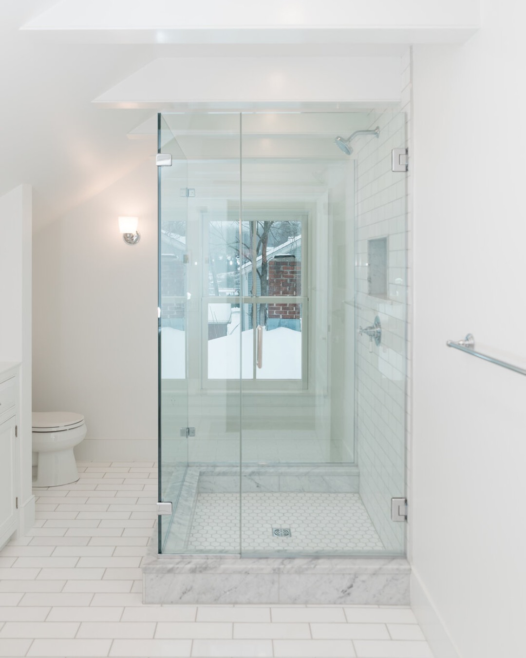 This stunning bathroom renovation is the result of a close collaboration between Sawteeth and the homeowners. From the first removal of plaster to the final touches on custom millwork, every detail was a joint effort. Together, the team designed unique box-beams to maximize ceiling height, selected luxurious Thassos marble tiles, and crafted custom cabinetry that ties the entire space together.
The custom vanity and built-in cabinetry not only add beauty but also offer practical storage solutions, with a hidden medicine cabinet behind the mirror for extra space.
Bathrooms are the perfect place to showcase your style, and this one truly reflects the homeowners' vision. Looking to bring your bathroom remodel to life? Let’s talk!
