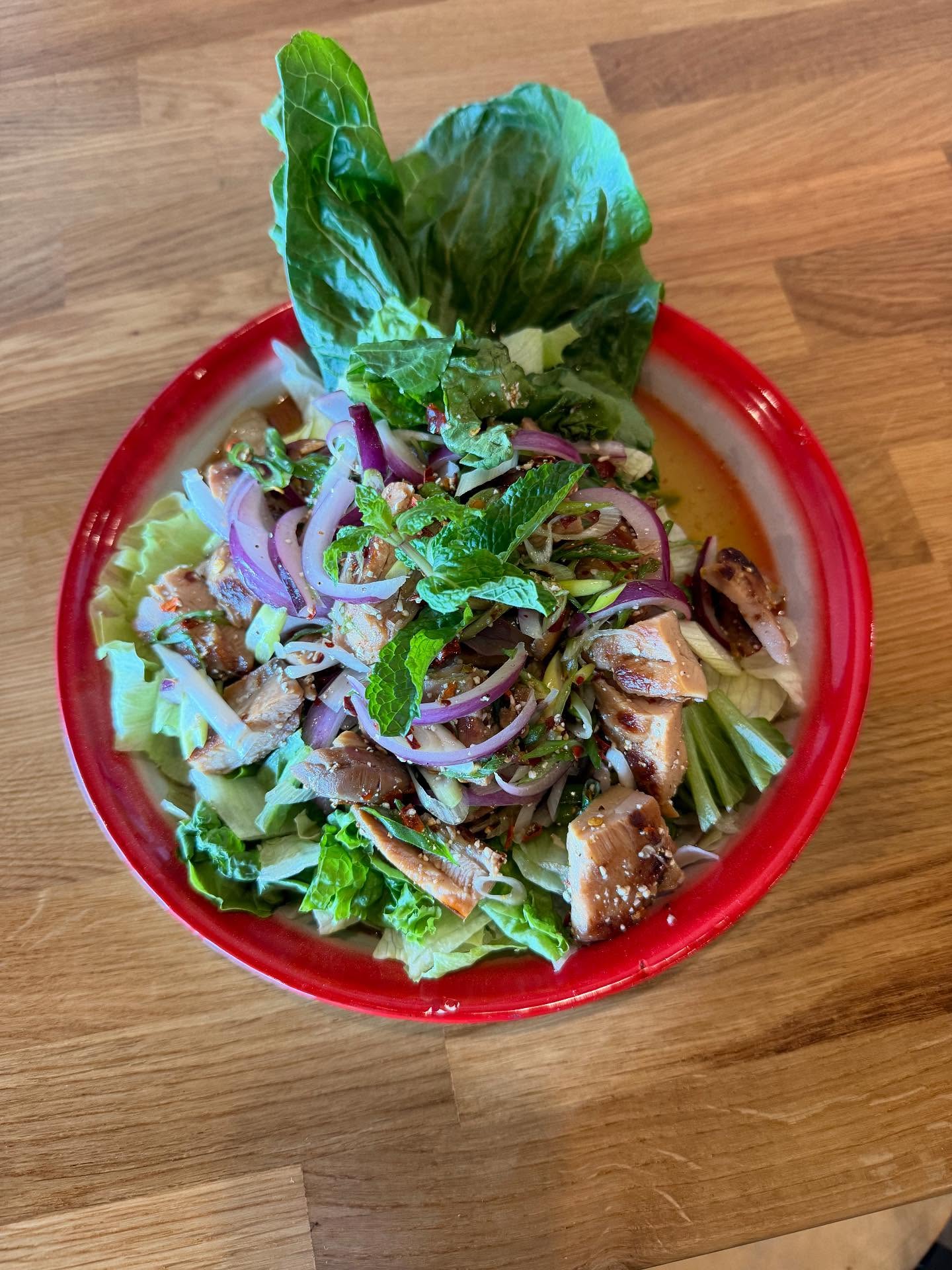 Introducing Larb Grilled Chicken Salad (shown 1st) and Chicken Lettuce Wraps (2nd). Come try them out!