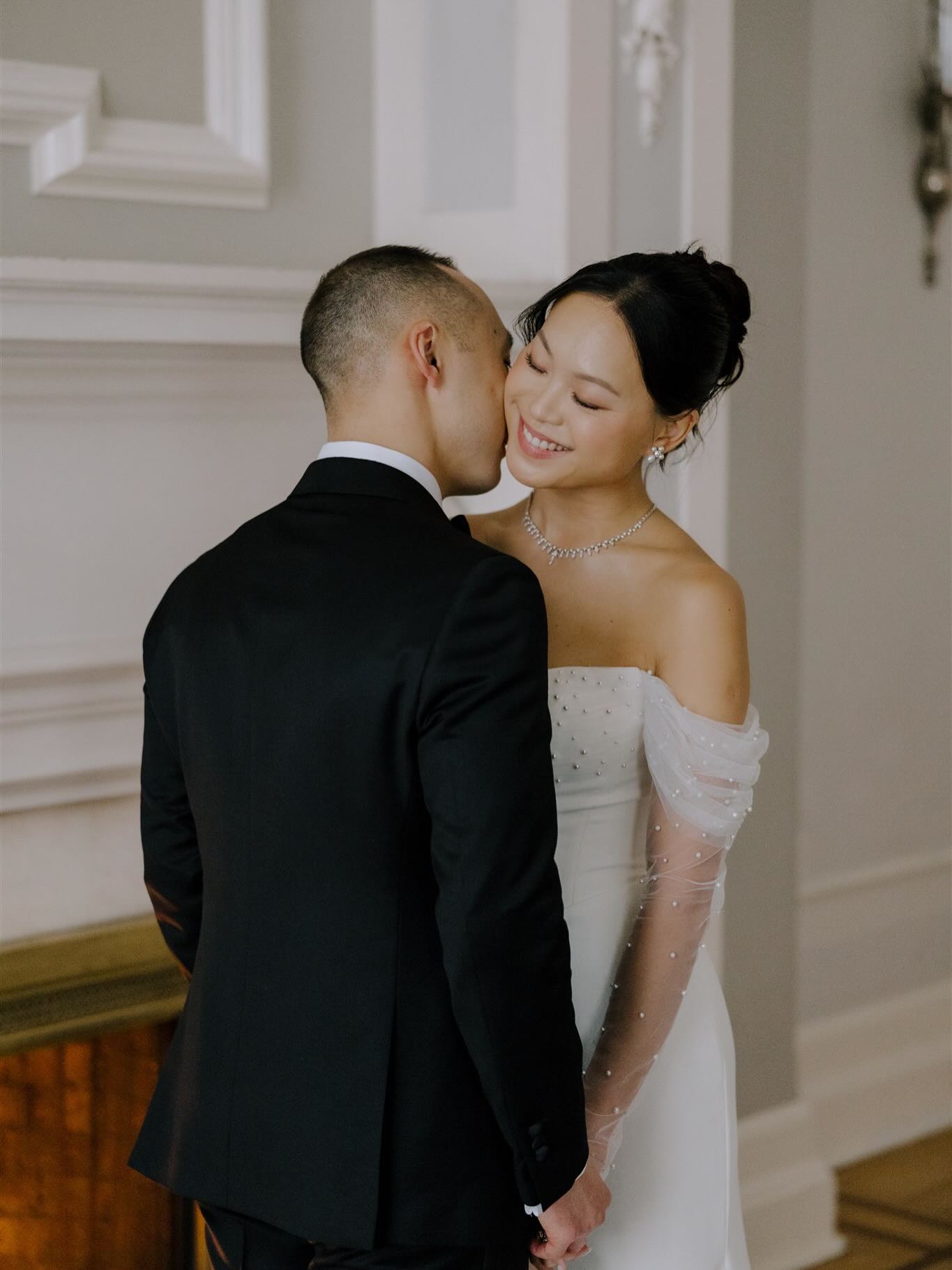 The wedding morning began with a soft, intimate energy as Consuela got ready adorned in delicate lace before slipping into her dress — a sculptural gown with sheer pearl-dotted sleeves and a beautifully modern silhouette. It was romantic without being overly traditional, fashion-forward without feeling fussy, and completely perfect for the tone of the day.
Meanwhile, Marcus’ classic black tuxedo set the tone for a sophisticated Vancouver wedding day. Together, their look was timeless: black tie, white florals, glowing candlelight, and that perfect blend of modern romance and old-world elegance.
Photographer: @pageandholmes
Planner: @plannedbyjill
Venue: @vancouverclub
Pet Sitter: DreamGroup — because just sometimes we do that too!
#vancouverwedding #luxuryweddings #dreamgroupplanners #vancouverweddingplanner